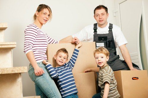 Packed moving boxes and furniture ready for transport